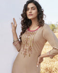 Beige Colored Casual Wear Rayon Embroidered Work Kurtis